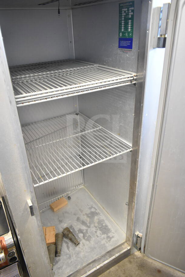 Traulsen G10010 commercial single door reach-in cooler, 115 volts, 1 phase. Features steel shelves and interior. Used condition.