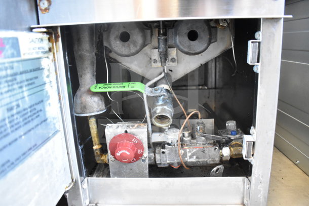 Cecilware countertop deep fat fryer interior showing gas valve, red knob, and visible piping, with industrial wear.