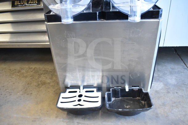 Commercial countertop 2 hopper slushie machine, stainless steel, 115 volts, 1 phase, visible drip trays, excellent condition.