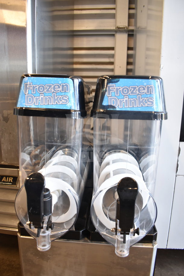 Commercial countertop slushie machine with 2 hoppers, labeled "Frozen Drinks," 115 volts, 1 phase, in good condition.