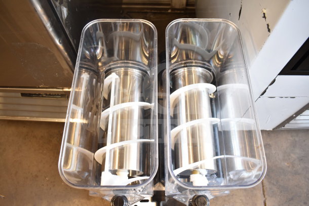Commercial countertop slushie machine with 2 hoppers, 115 volts, 1 phase. Stainless steel augers, excellent condition.