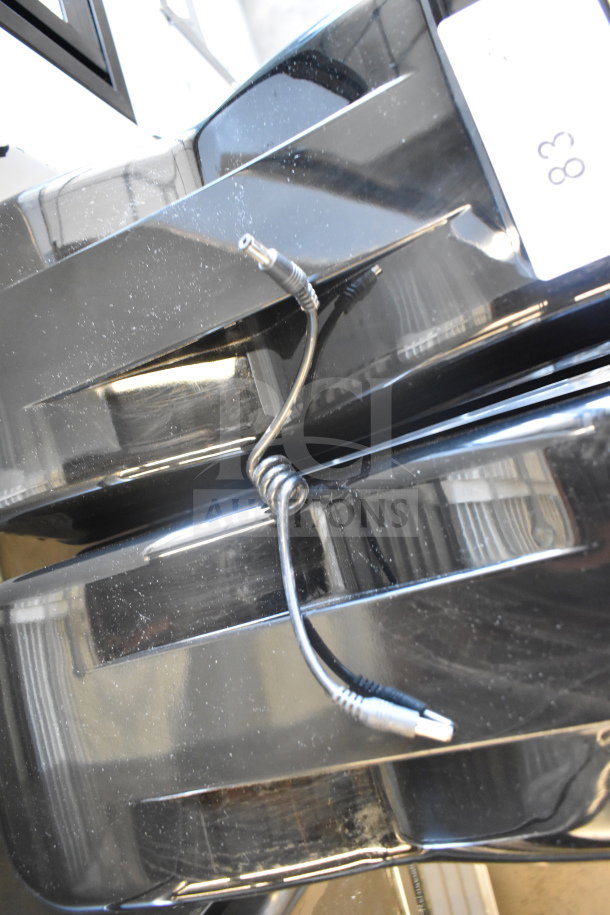 Commercial countertop 2 hopper slushie machine, 115 volts, 1 phase, black casing, wire connection visible, label marked "380".
