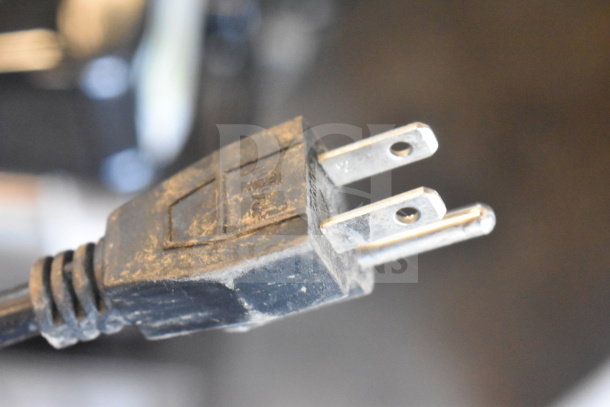 A close-up of a power plug for a Commercial Countertop 2 Hopper Slushie Machine, 115 volts, 1 phase.