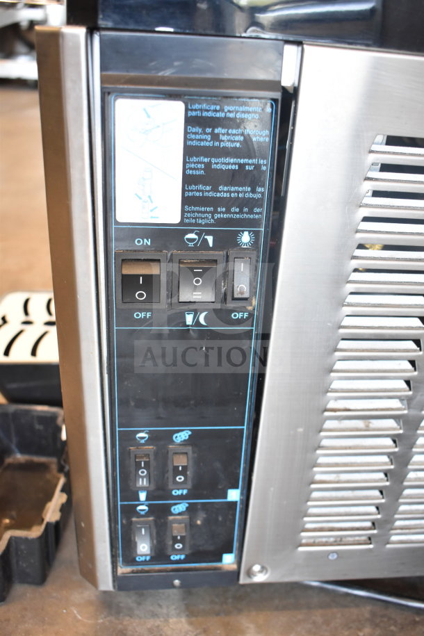 Commercial countertop slushie machine with 2 hoppers, featuring control panel switches. Operates on 115 volts, 1 phase.