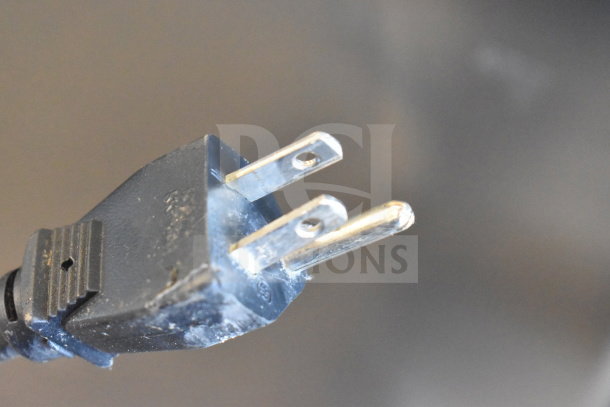 Close-up image of a plug for Blue Air BASR2 Commercial 2 Door Reach In Cooler, 115V, 1 Phase. Visible wear.