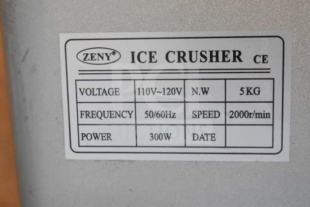 Zeny Countertop Ice Crusher label showing voltage 110-120V, 300W power, and speed 2000r/min.