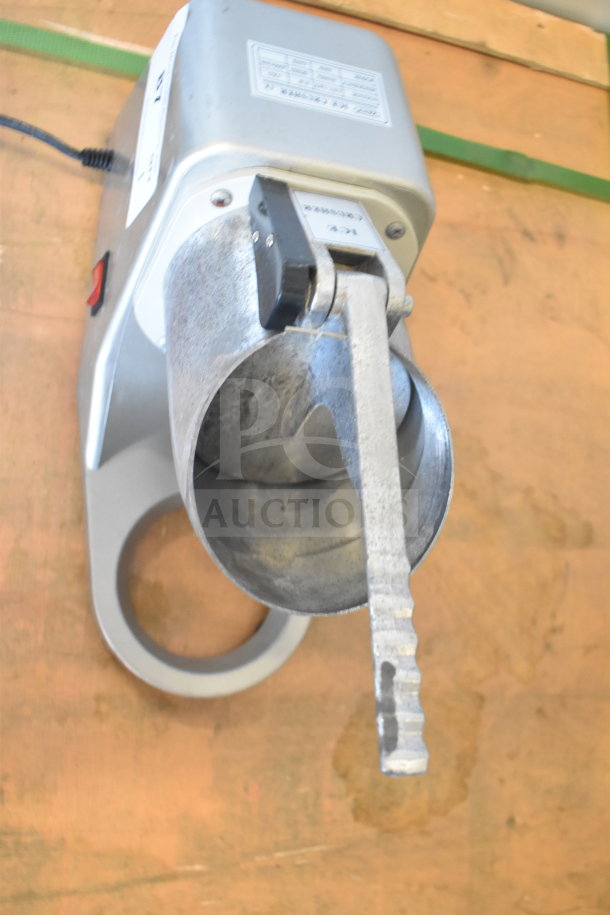 Zeny Countertop Ice Crusher, 110-120V, 1 Phase, features metal crusher arm, on/off switch, visible voltage label, in good condition.