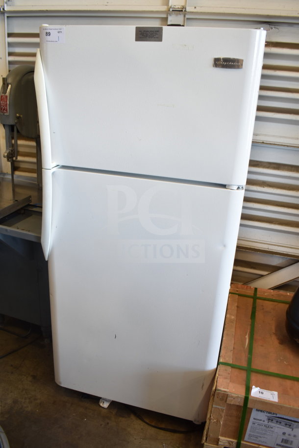 Frigidaire FRT18HS6JW1 reach-in cooler with freezer, white, 115 volts, 1 phase, minor exterior wear, top door label visible.