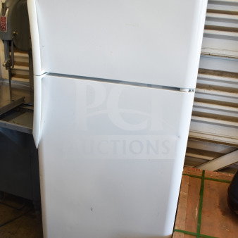 Frigidaire FRT18HS6JW1 reach-in cooler with freezer, white, 115 volts, 1 phase, minor exterior wear, top door label visible.