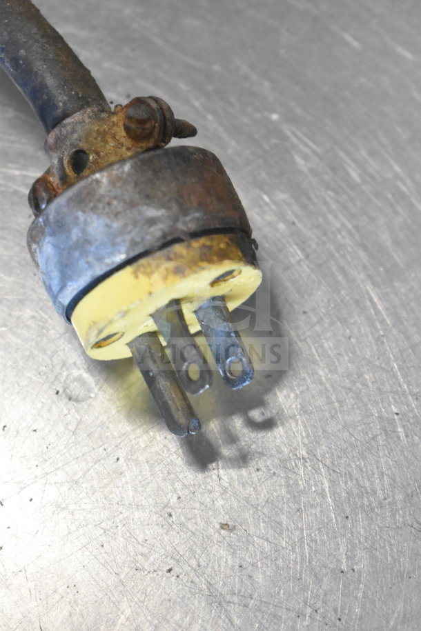 Close-up of a worn-out electrical plug on the Biro 22 Commercial Floor Style Meat Saw.