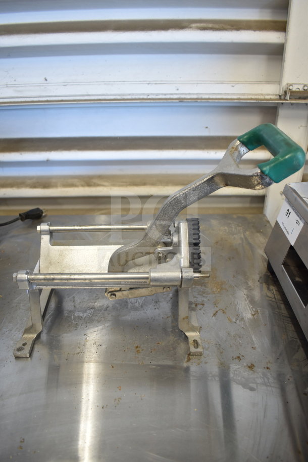 Garde Countertop French Fry Cutter, metal frame, green handle, used condition with visible wear, ideal for commercial use.