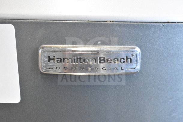 Hamilton Beach HMD400 label, commercial 3-head drink mixer, 120V, 1 phase, metal finish, model identification tag visible.