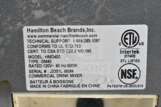 Hamilton Beach HMD400 Drink Mixer label showing model, voltage, certifications, and serial number.