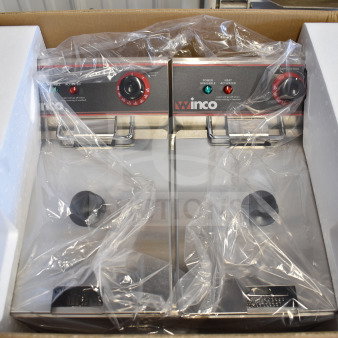 Brand new Winco EFT-32 electric countertop fryer, 2 bays with lids, in original packaging; minor scratches noted.