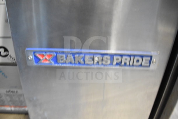 Bakers Pride commercial deep fat fryer with two metal fry baskets, stainless steel, "Bakers Pride" label visible.