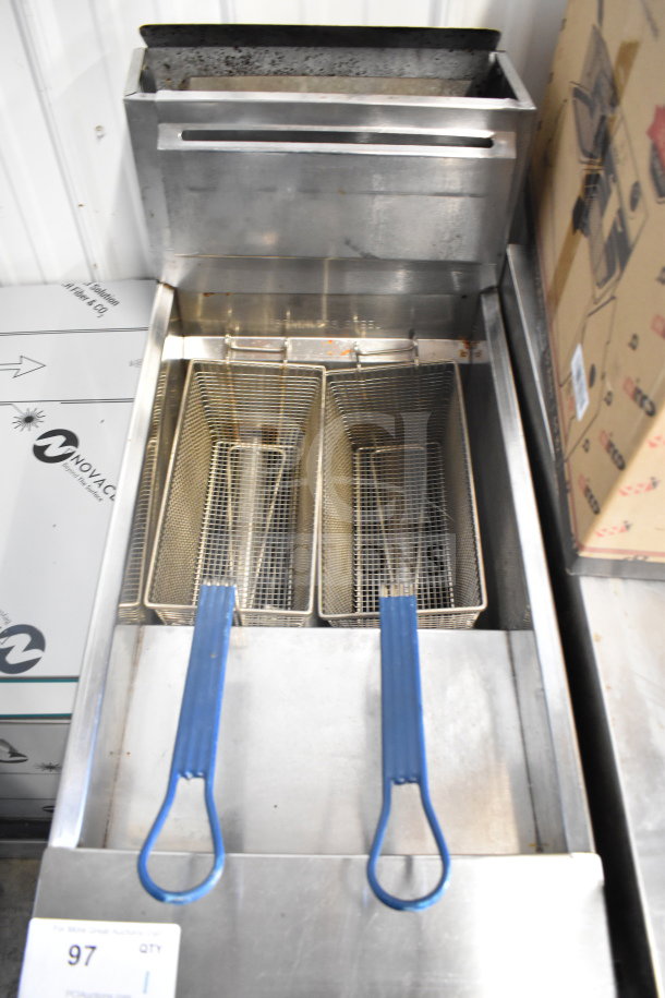 Bakers Pride commercial floor-style deep fat fryer, featuring two metal fry baskets with blue handles. Appears in used condition.