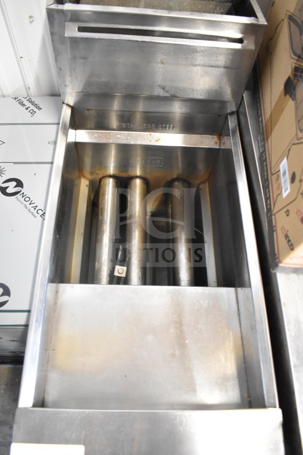 Bakers Pride commercial deep fryer, floor model, stainless steel, with two metal fry baskets. Visible marking: "Oil Level."