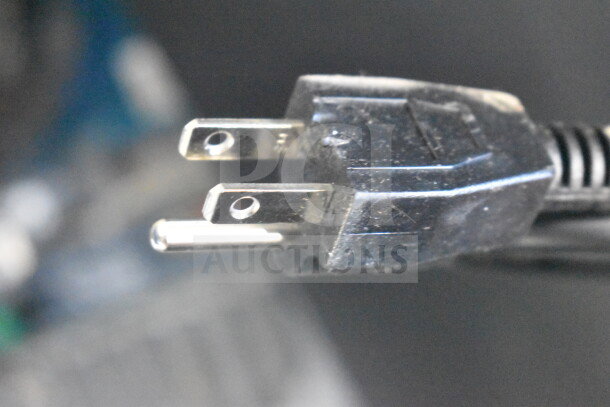Black electrical plug of the Galaxy 177CRG2B Mini Cooler, showing standard two-prong design.
