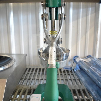 BRAND NEW Garde 181MCJ2 Manual Citrus Juicer, safety spring, green handle, visible caution label, minor scratches.
