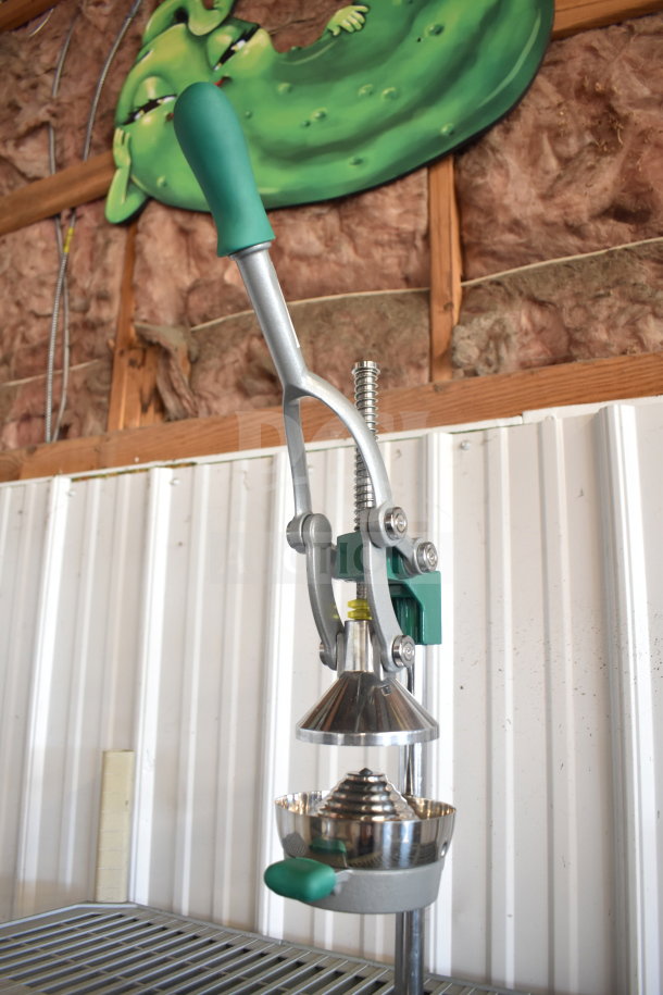 Brand new Garde 181MCJ2 manual citrus juicer with safety spring, scratch and dent condition, sturdy metal construction.