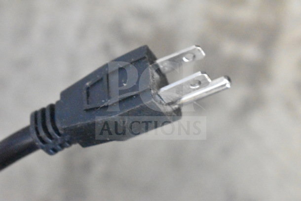 Close-up image of a power plug attached to the Avantco 177STE3S steam table.