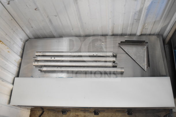 Brand new Avantco 177STE3S three-pan electric steam table parts on display; includes legs and undershelf components.