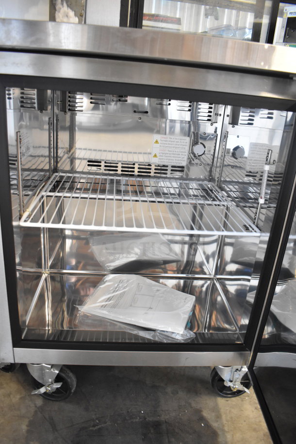 Master-Bilt UF27 single door undercounter freezer on casters, stainless steel, 115 volts, excellent condition, interior shelving.