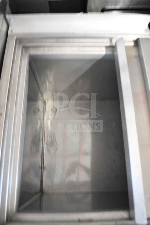 H&K 52473-1 commercial chest freezer, interior view, 120 volts, 1 phase, stainless steel, sturdy construction.