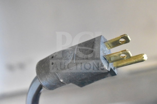 Close-up of a 120V plug from the H&K 52473-1 commercial chest freezer. Image shows plug details and condition.