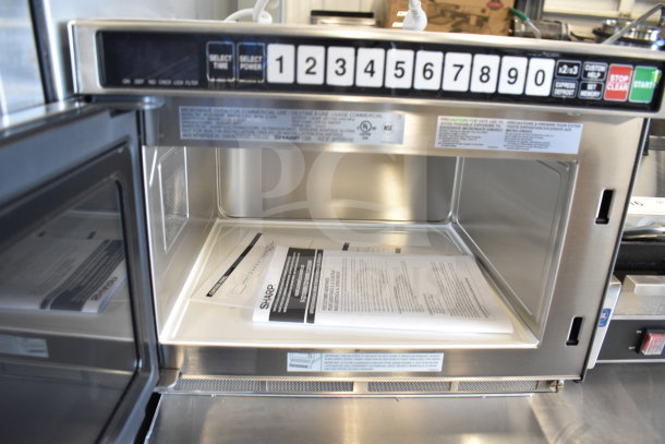 2017 Sharp R-CD1800M commercial countertop microwave with touchpad, open door view, 208/230V, 1 phase, excellent condition.