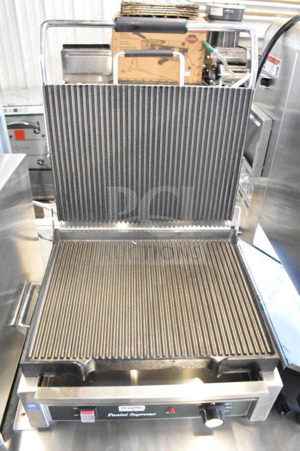 2021 Waring WPG250 commercial countertop panini press with ribbed plates, 120 volts, 1 phase, in excellent condition.