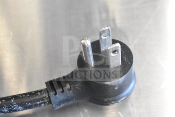 Close-up of a power plug from the Arctic Air AUC48RZ Commercial 2 Door Undercounter Cooler, 115 Volts, 1 Phase.