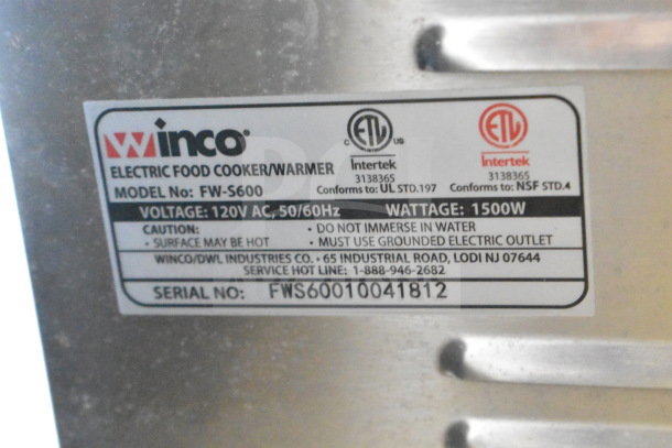 Winco FW-S600 Countertop Food Warmer label. Model FW-S600, 120V, 1 phase, 1500W. Caution: Surface may be hot. Serial: FWS60010041812.