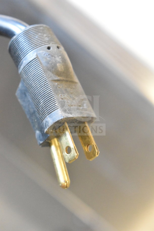 Close-up of 2021 H&K 52473-1 Commercial Chest Freezer plug, 120V, 1 phase, showing power connector in used condition.