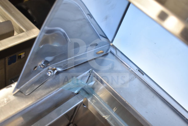 Avantco Commercial Sandwich Salad Prep Table, stainless steel interior detail, mega top, on commercial casters, 115V, 1 phase.