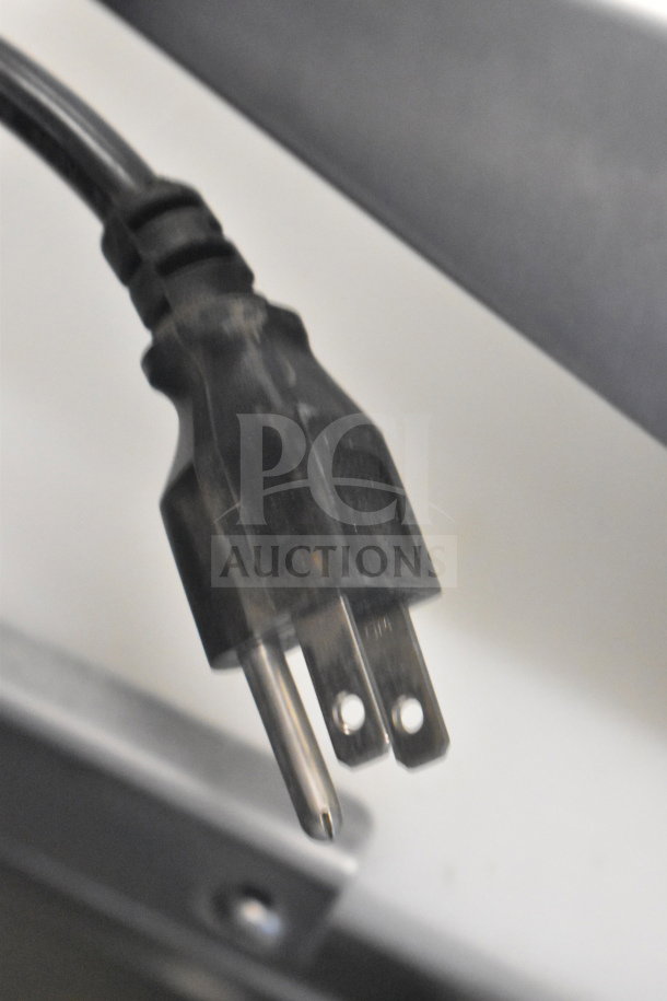 An Avantco Commercial Sandwich Salad Prep Table plug, 115 volts, 1 phase. Features include commercial casters for mobility.