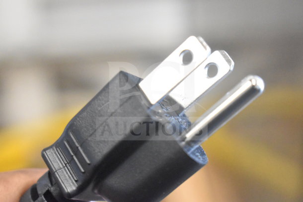 Close-up of a power plug for the 2020 Hobart HTi-7LH4W Commercial Scale, showing the prongs and cable.