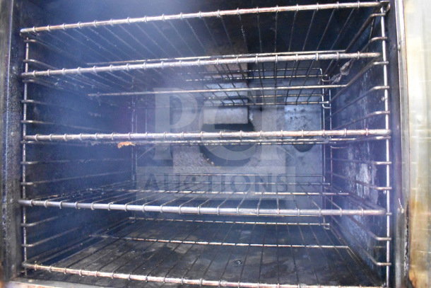 Royal RCOS-1 commercial convection oven interior with view-through door, showcasing racks. Natural gas powered, thermostatic controls.