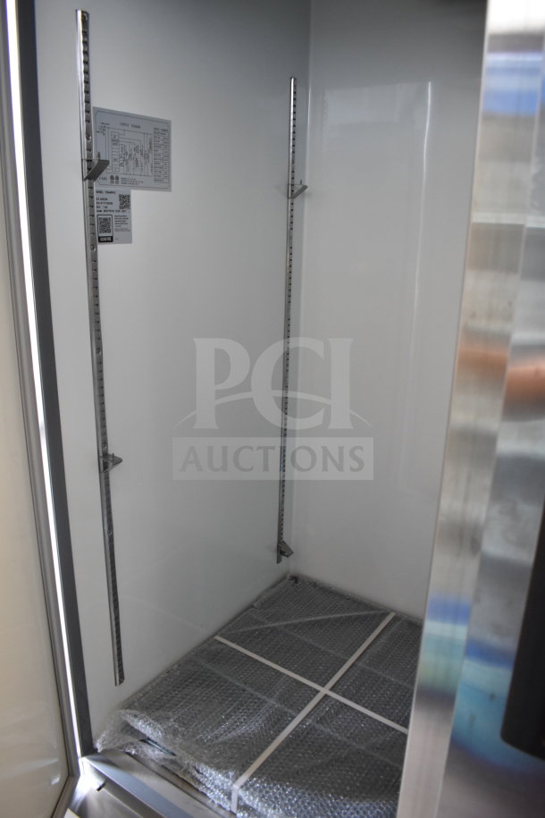 Brand new Avantco 178A49FHC commercial 2-door reach-in freezer, 115V, 1-phase, interior view, with tags and bubble wrap.