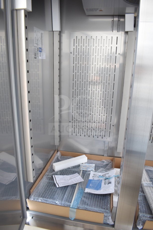 Brand new Avantco 178SS2FHC commercial 2-door reach-in freezer on casters. Includes packaging materials and product literature.