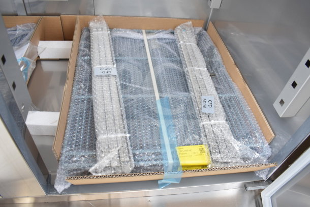 Brand new Avantco 178SS2FHC commercial 2-door freezer with packaging, visible labels, and commercial casters. 115 Volts.
