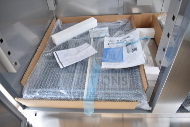 Brand new Avantco 178SS2FHC commercial freezer parts in packaging, includes manuals and accessories; some scratches visible.