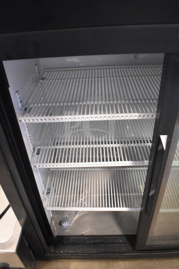 2021 True GDM-09-SQ-HC-LD commercial 2-door reach-in cooler, 115V, 1 phase, features shelving, used condition.