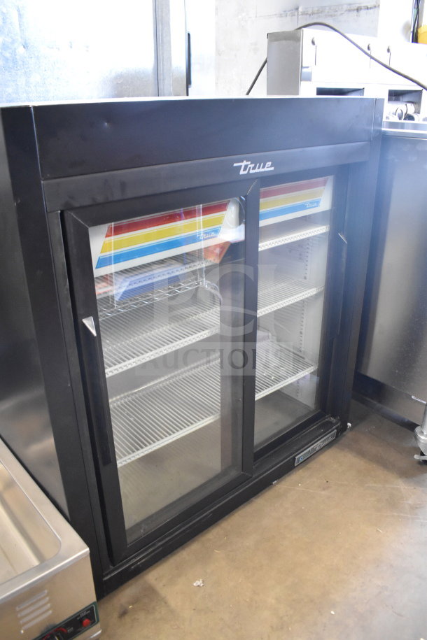 2021 True GDM-09-SQ-HC-LD commercial 2-door reach-in cooler, black finish, brand logo, 115V, excellent condition.
