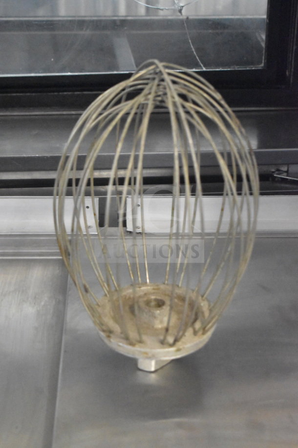 Commercial whisk attachment for Hobart mixer, metal wires, slight wear, excellent for heavy-duty mixing tasks.
