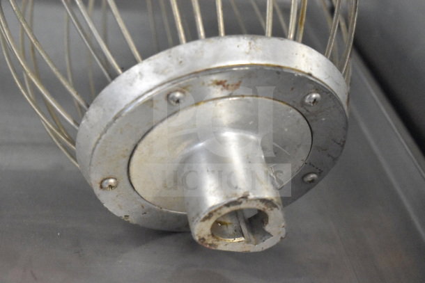 Commercial whisk attachment for Hobart mixer, metal construction, visible wear, fits Hobart models.