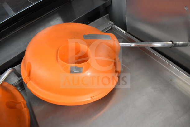 Dynacube Countertop Vegetable Cutter with orange housing and handle, features durable construction.