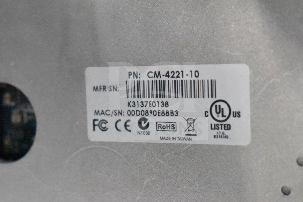 Security dome camera label showing PN: CM-4221-10, MFR SN: K3137E0138, MAC/SN: 00D0890E88B3, certifications, and made in Taiwan.