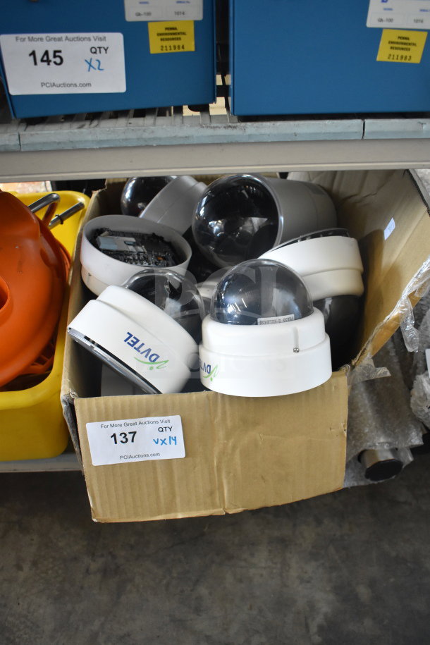 Box of 14 Ovtel security dome cameras in used condition. Auction tag indicates quantity as 14.