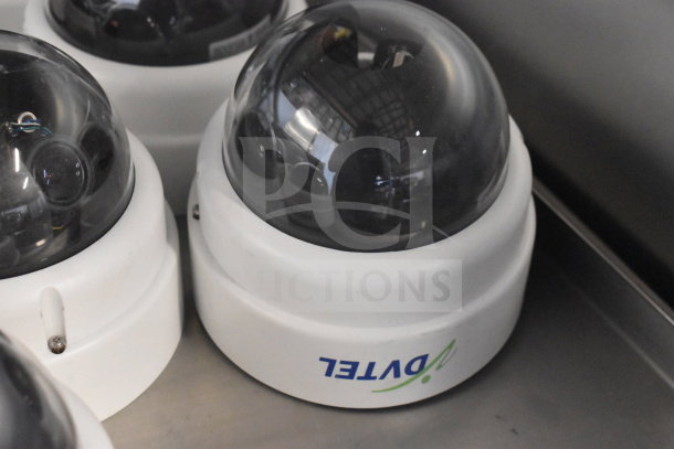 14 DVTEL security dome cameras, compact design, clear domes, white base, gently used, ideal for surveillance setups.